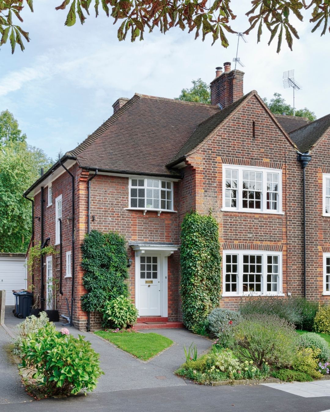 A detached home with a front garden